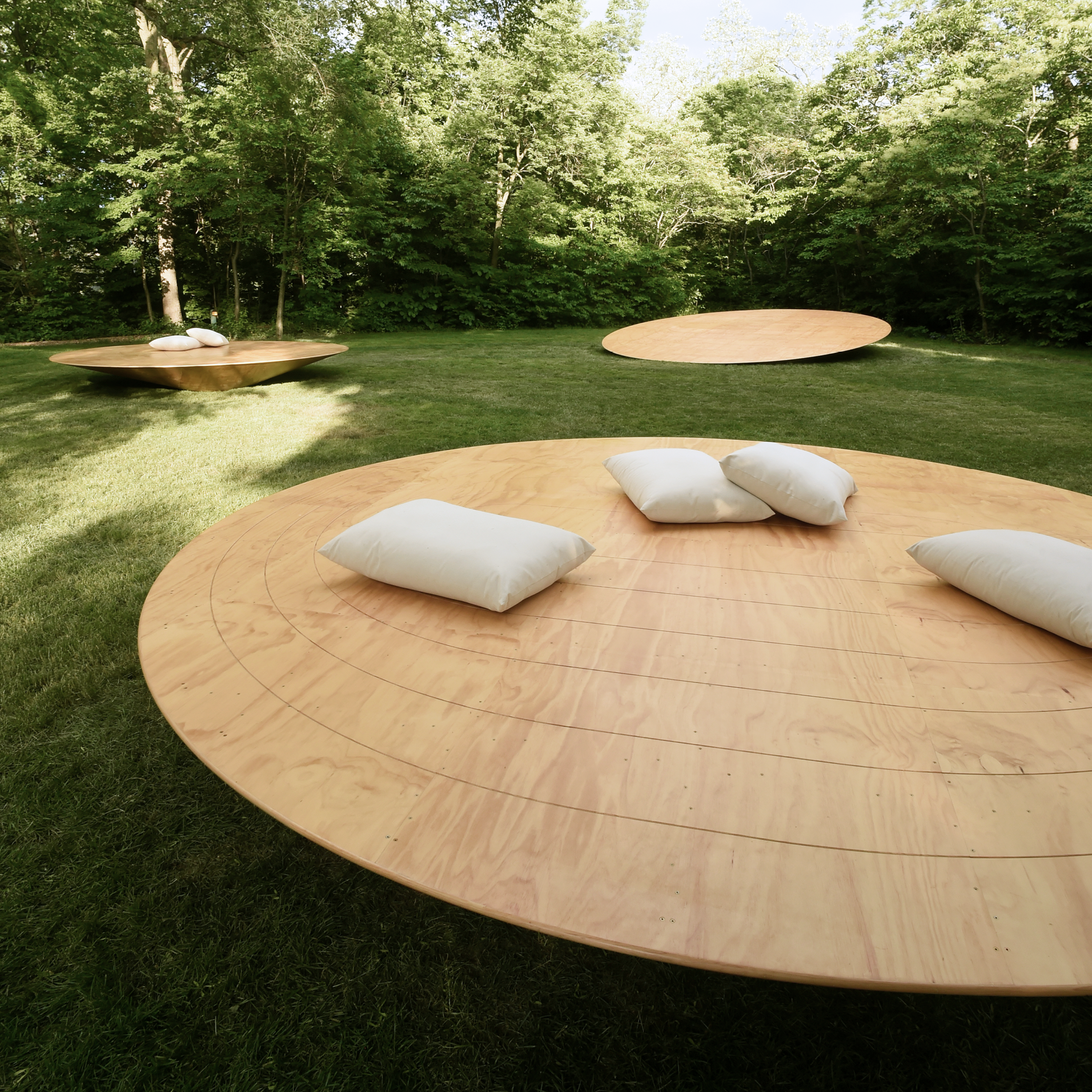 pillows distributed across plywood platforms