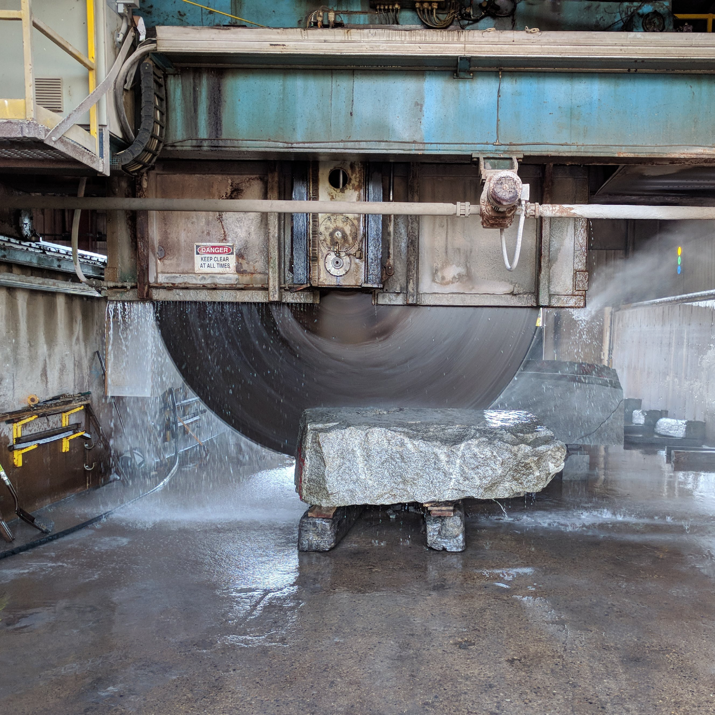 large saw cutting stone