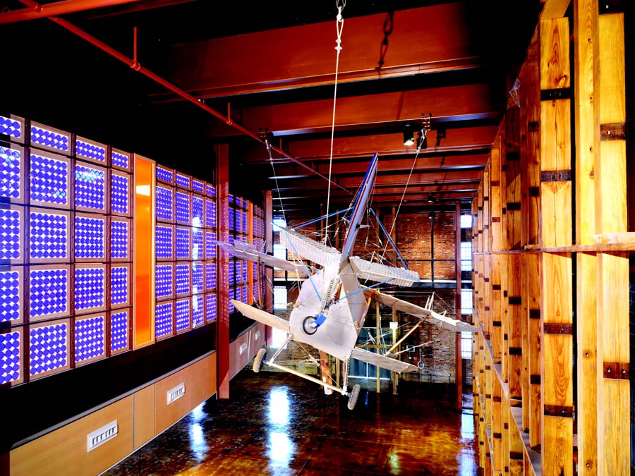 Building with wood and brick interior and glass wall