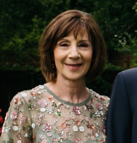 Photo of a middle-aged woman with brown hair.