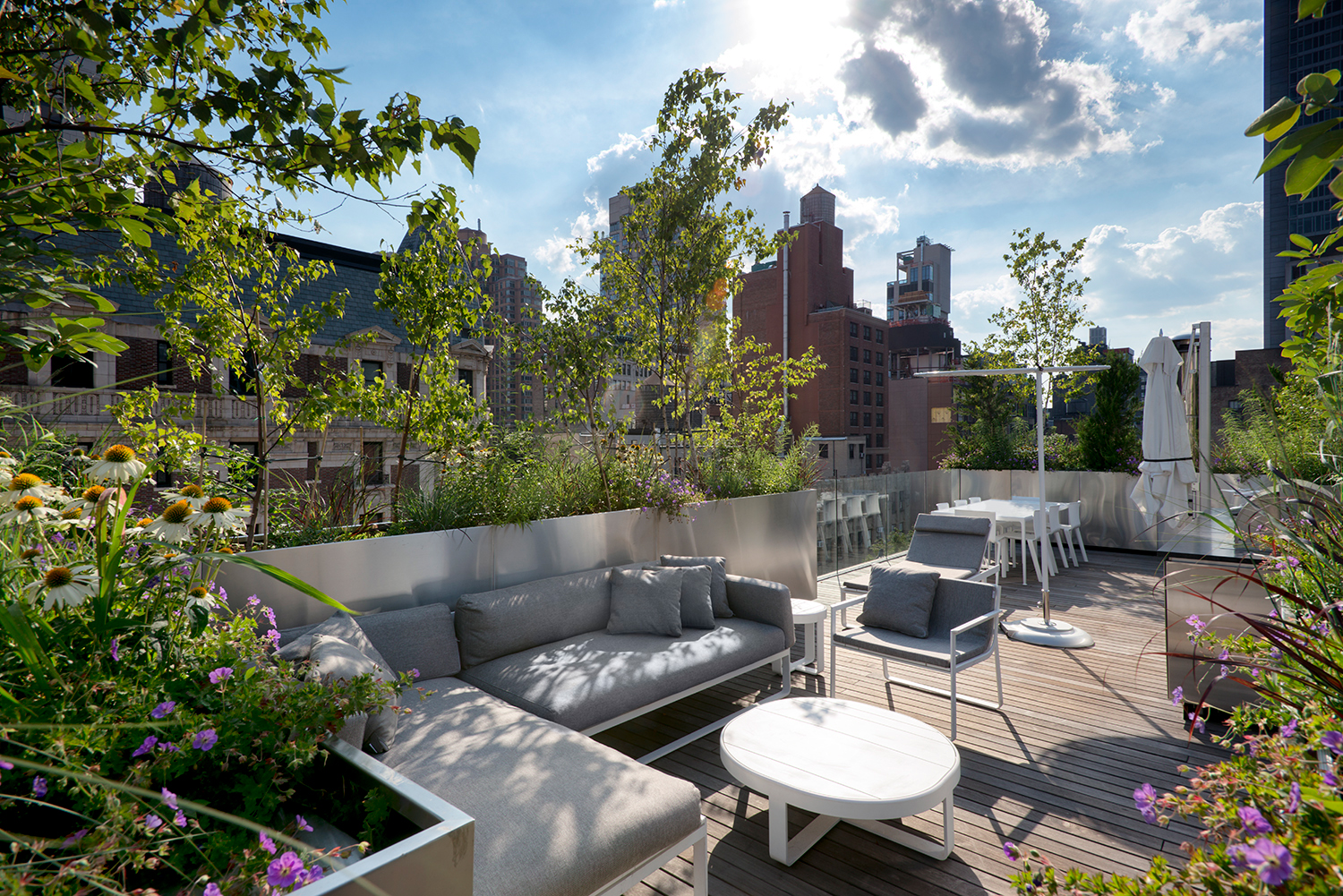 A rooftop features lounge seating.