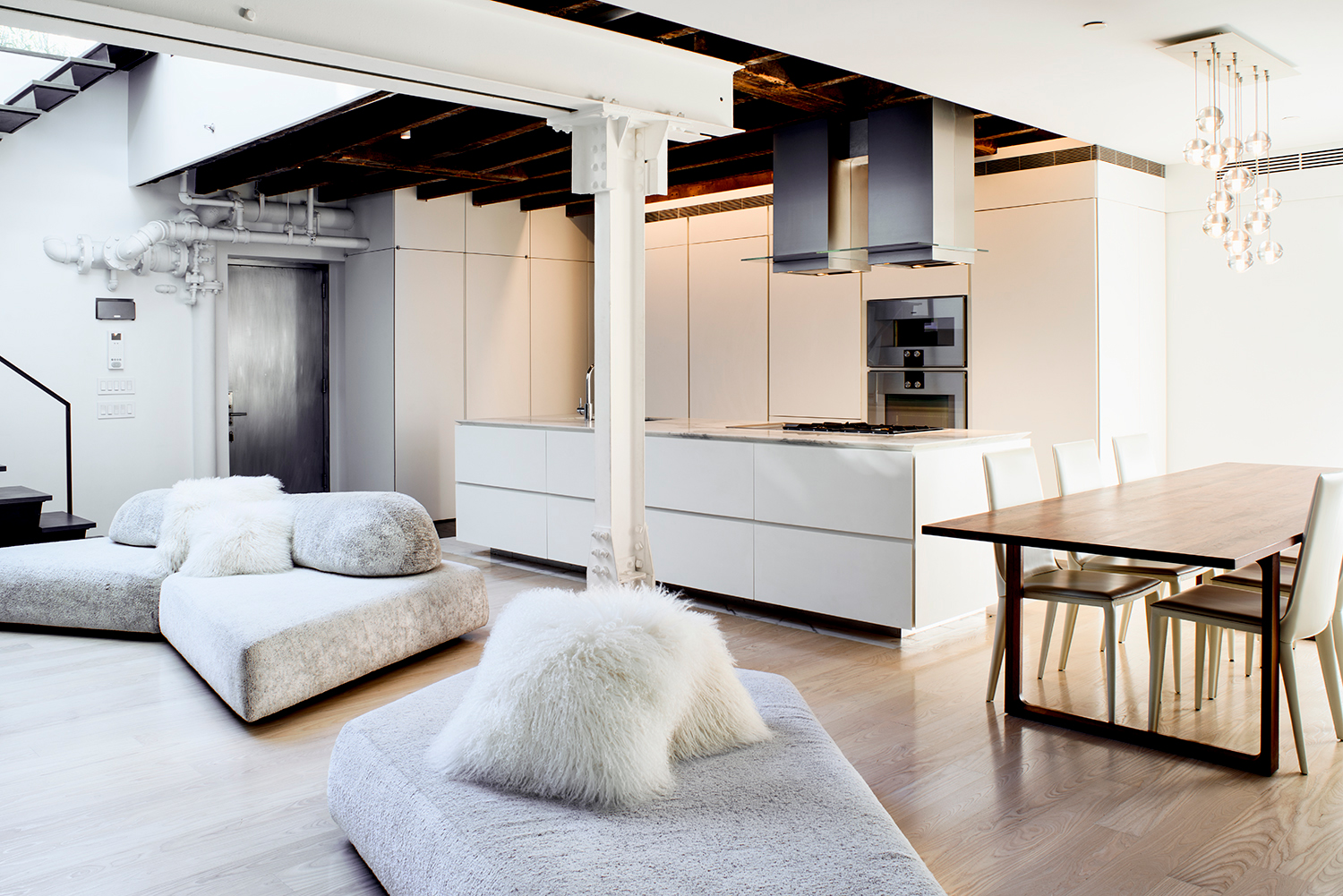 Open concept living room, kitchen, and dining spaces.