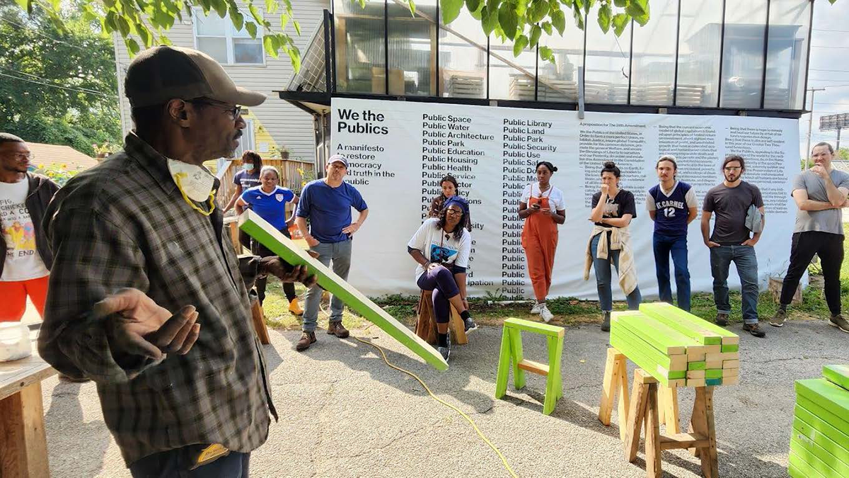 Students listening to an older man speak