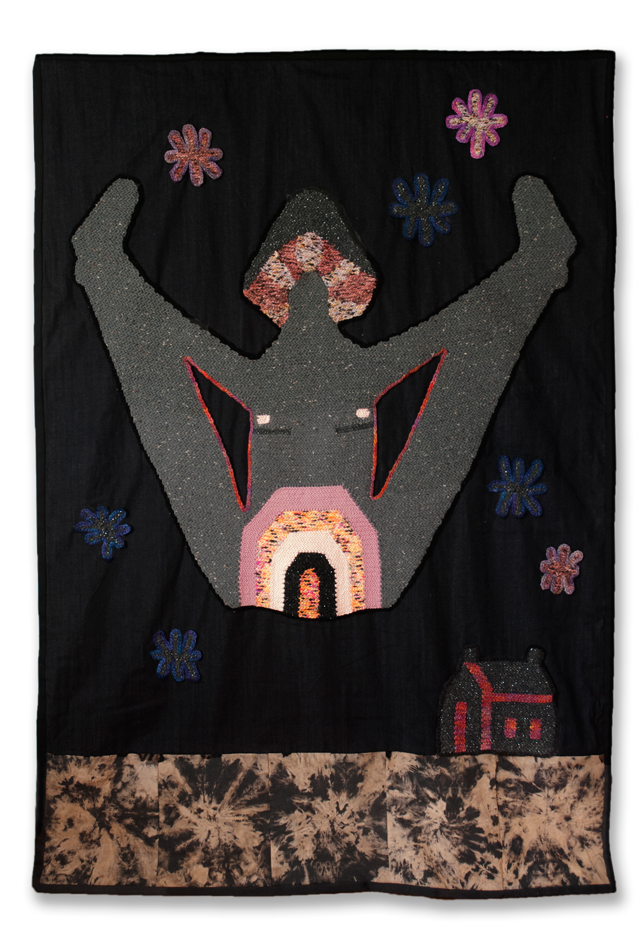 Grey crocheted figure with legs outstretched