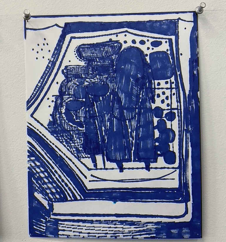 Painted blue and white shapes on paper pinned to a white board