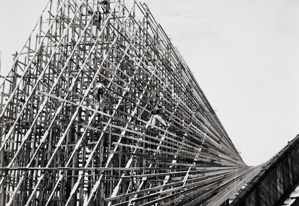 Wood formwork under construction with workers visible