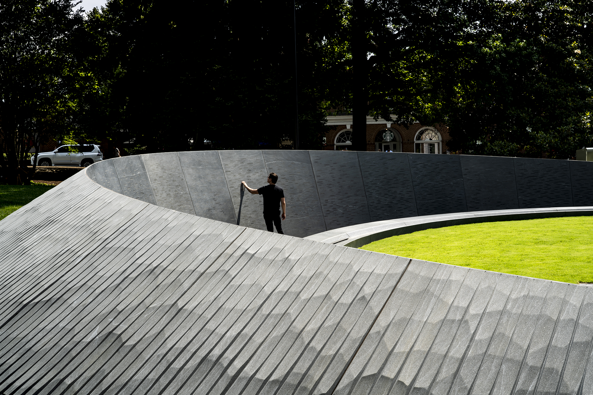 Person standing within a concrete memorial