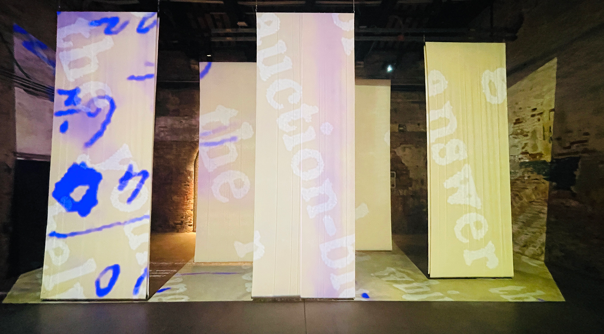 bits of text projected on material