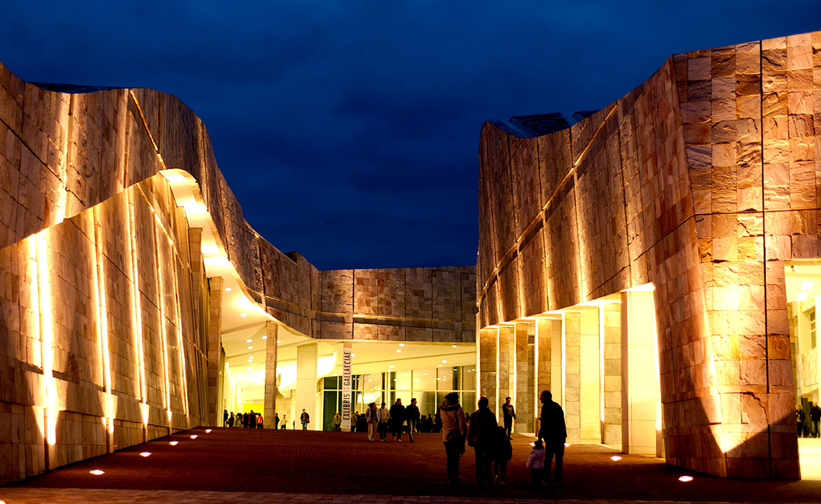 Exterior view of building entrance at night.