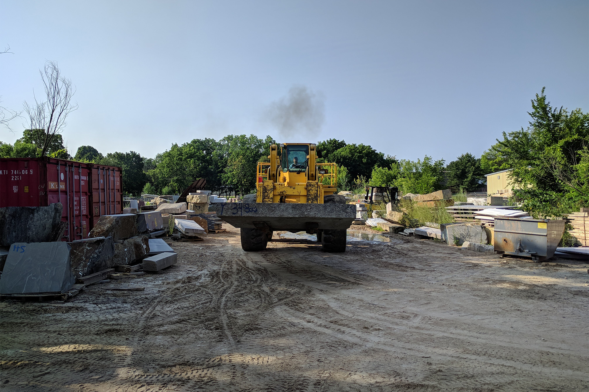 Heavy vehicle moving large stone