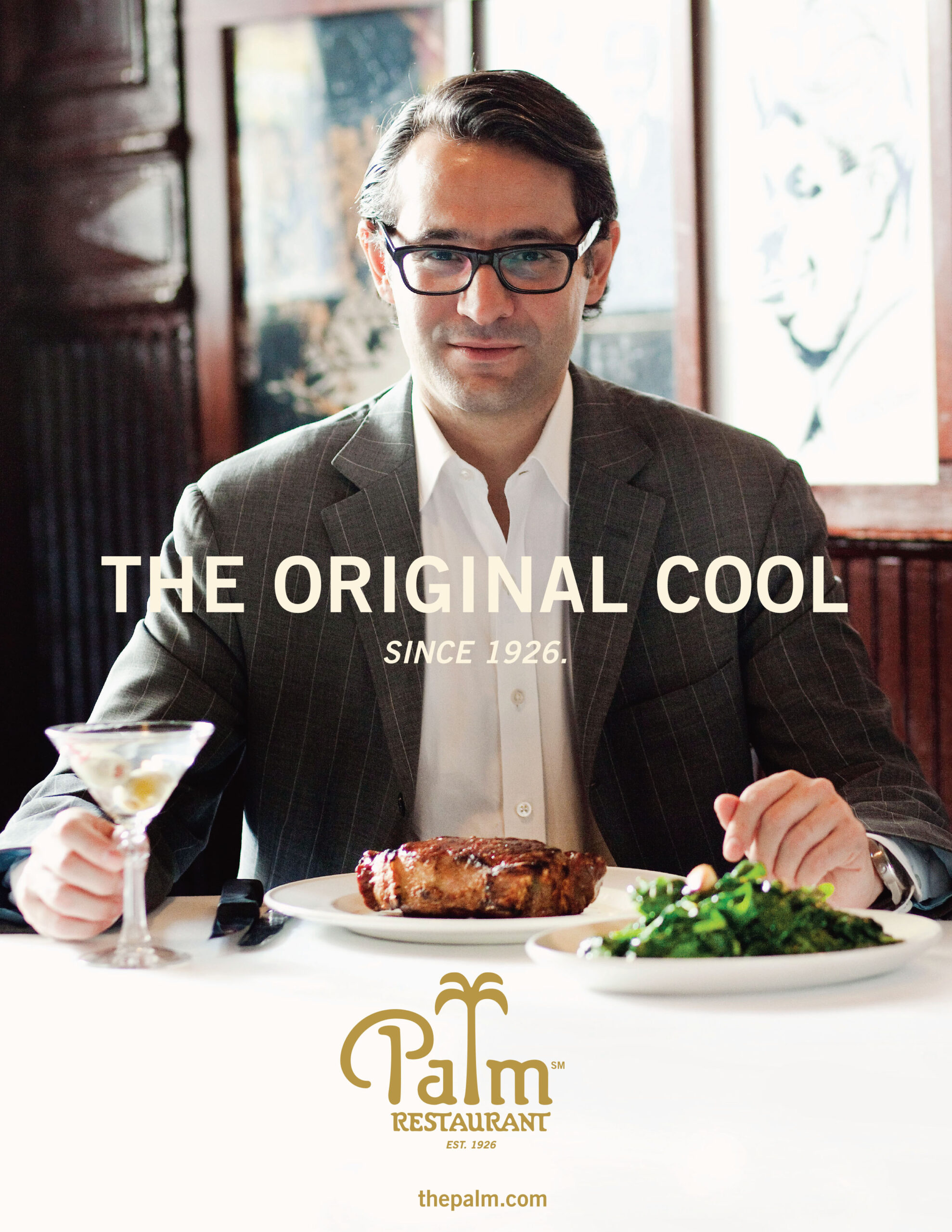 An ad for The Palm Restaurant depicts a man wearing glasses and business attire seated in front of his dinner in a restaurant. The ad includes the words 'The Original Cool since 1926'