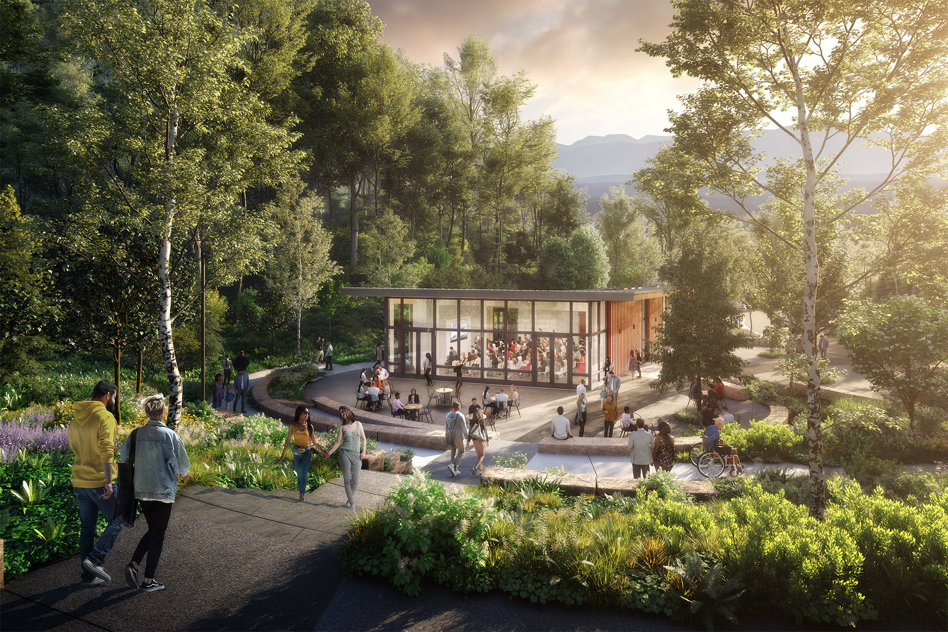 Contemporary building with large glass windows surrounded by an amphitheater