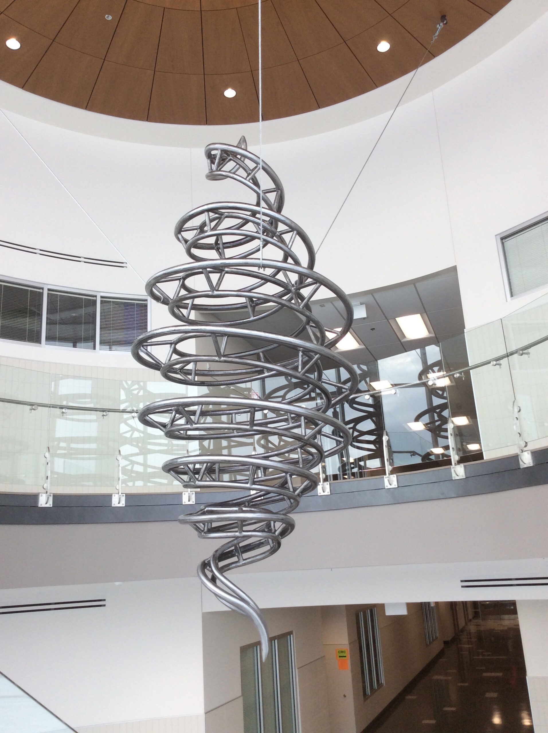 Steel creates a spiraling vortex in this 14-foot sculpture suspended with cables from the ceiling.