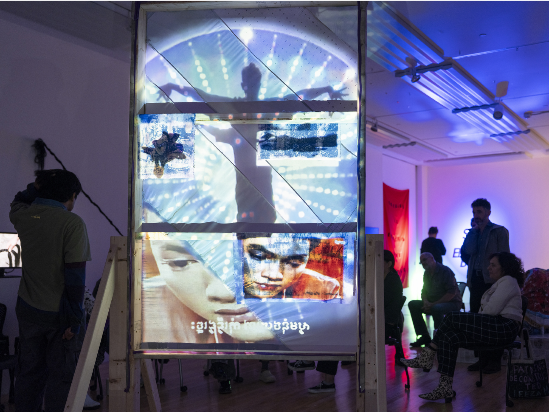 Projected artwork in a darkened gallery space