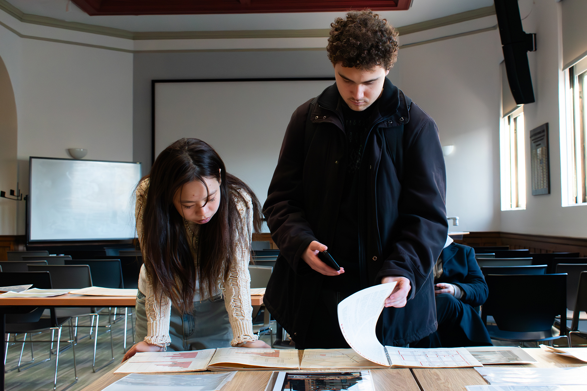 Students looking through documents