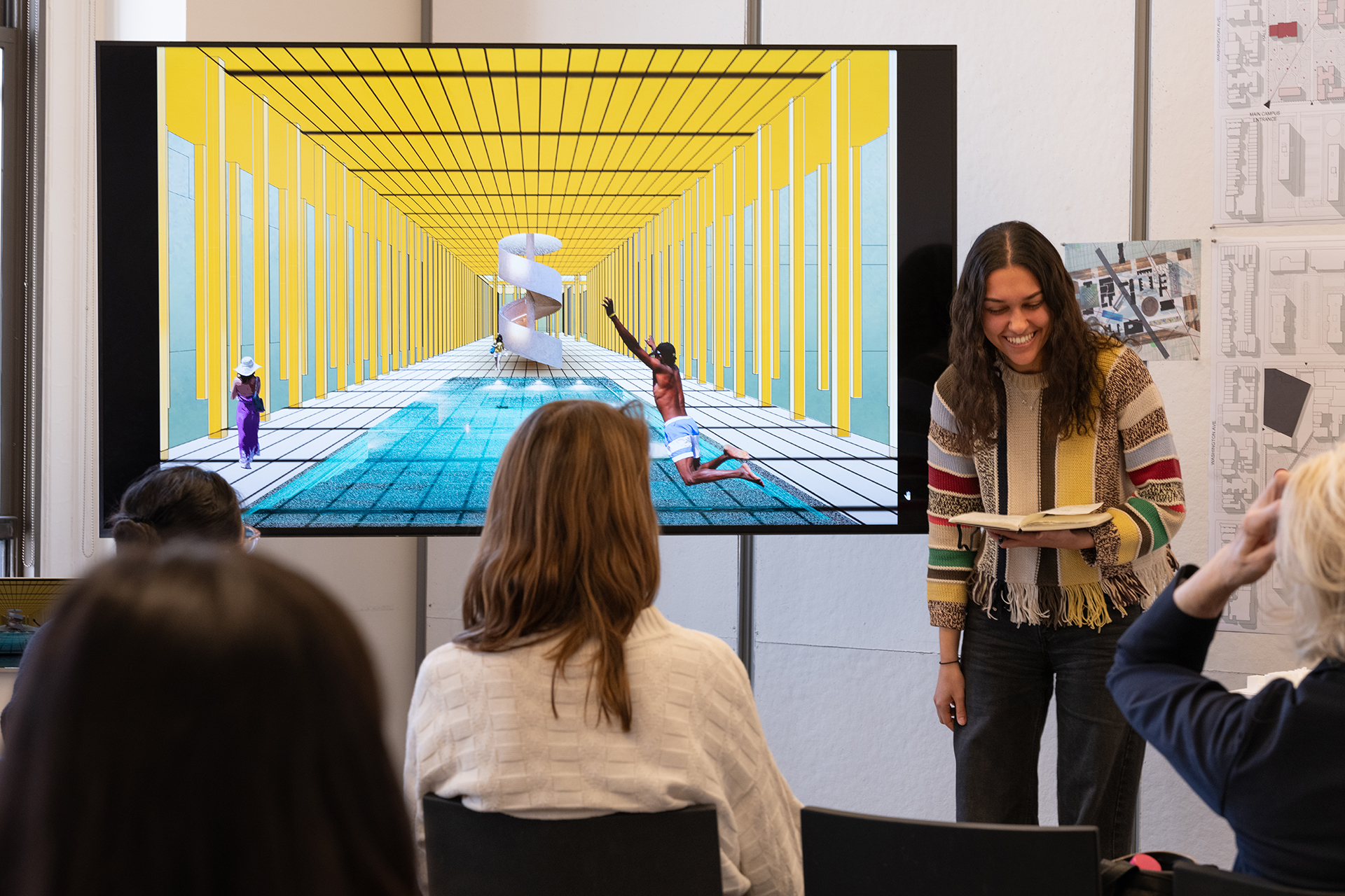 Student presenting work to a panel