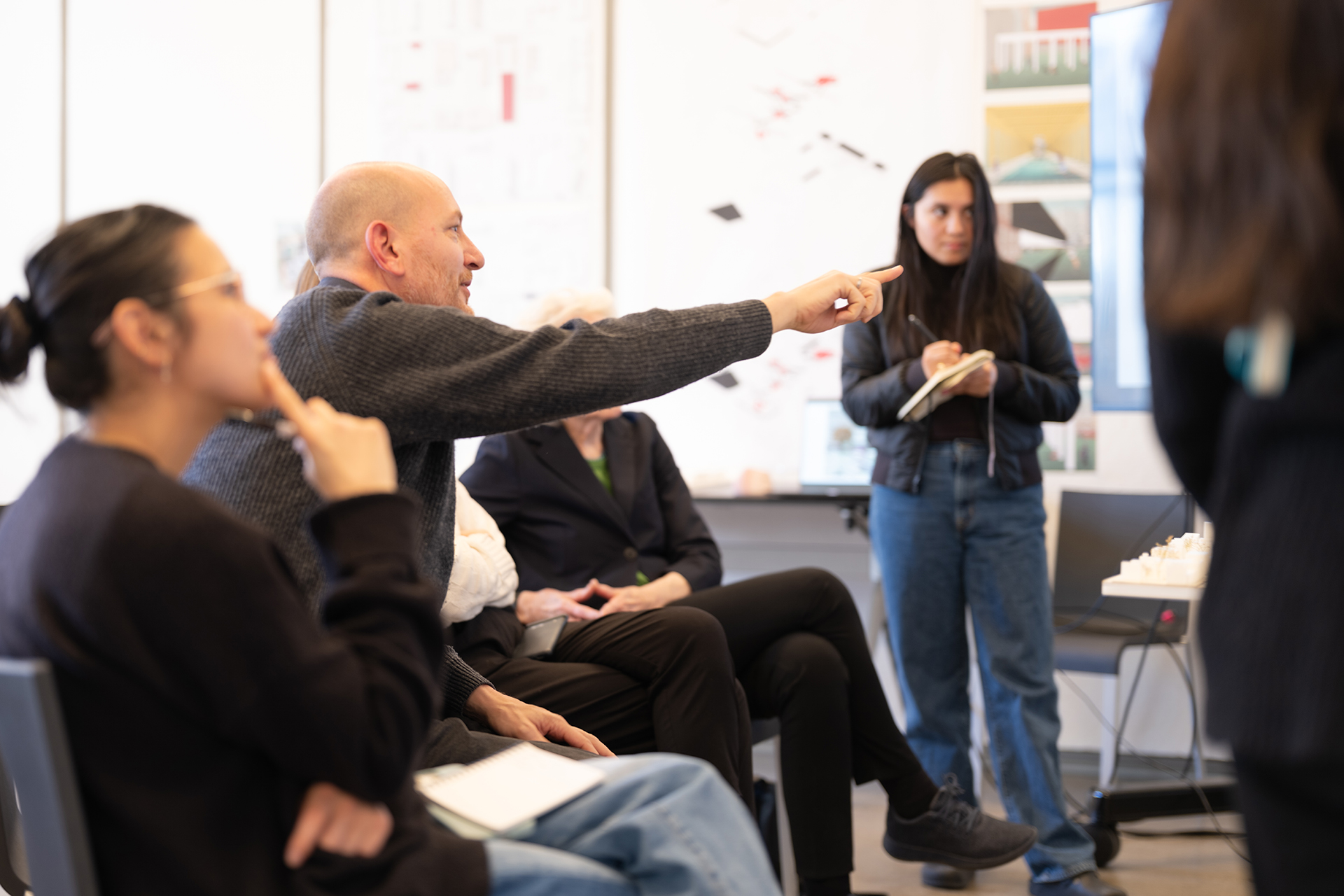 Professor giving feedback on student work