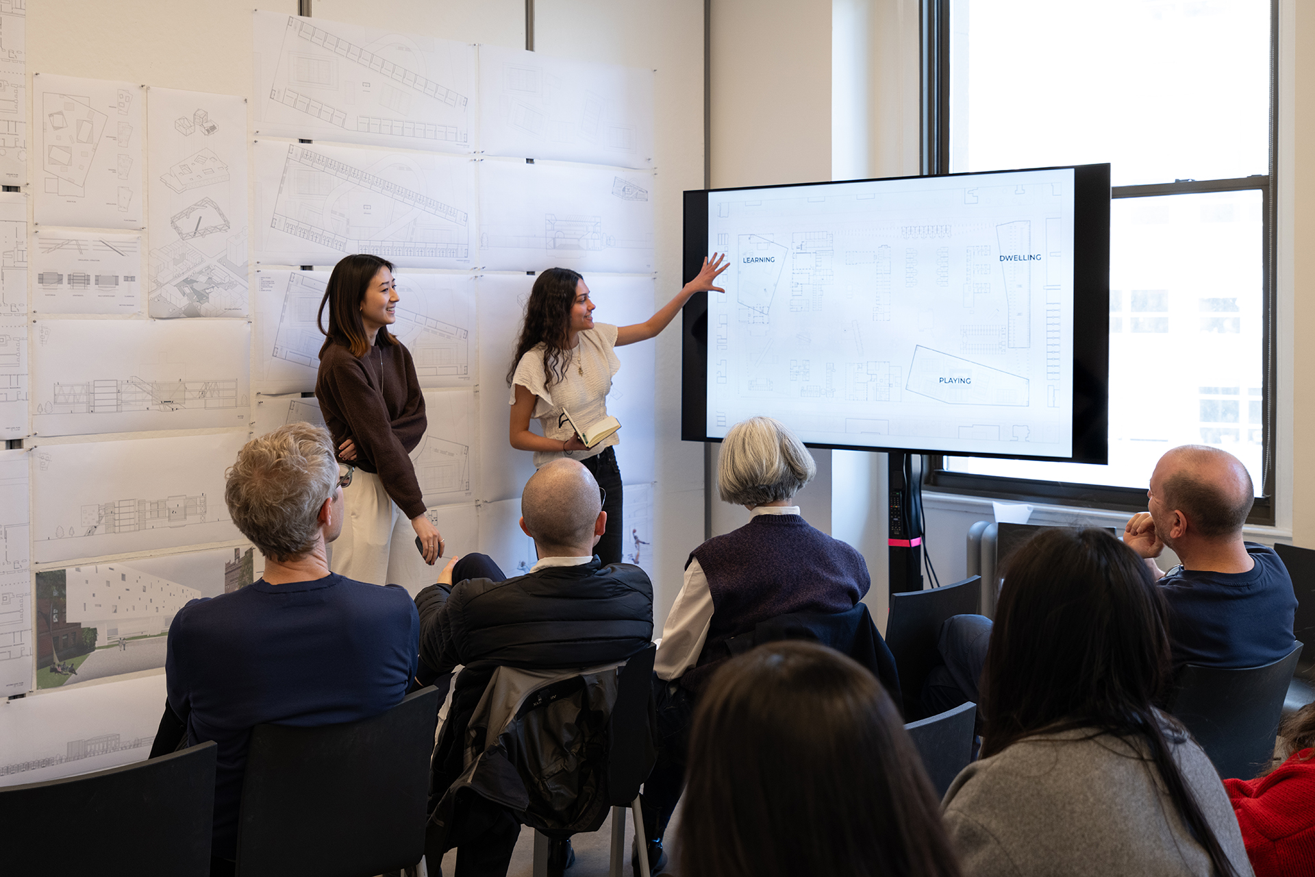Students presenting work to a panel
