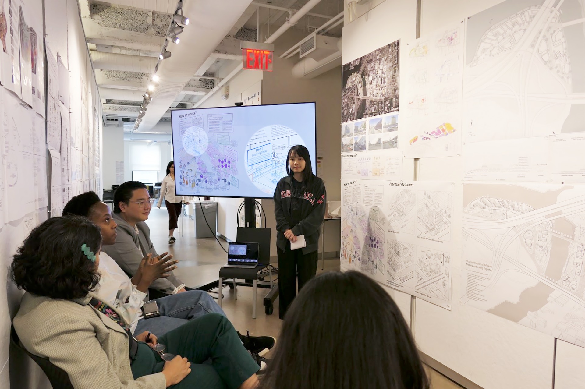 Student presenting work to a panel