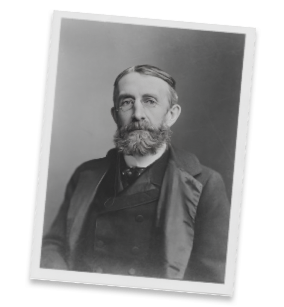 Historic image of man in formal dress and wearing glasses