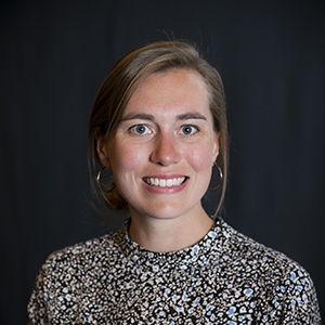 smiling woman wearing print shirt