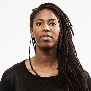 Person with long dark hair in dreadlocks