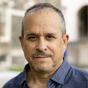 Man with facial hair and collared shirt