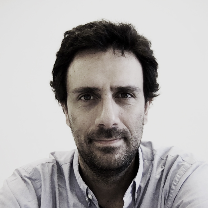 Man with brown hair and white shirt.