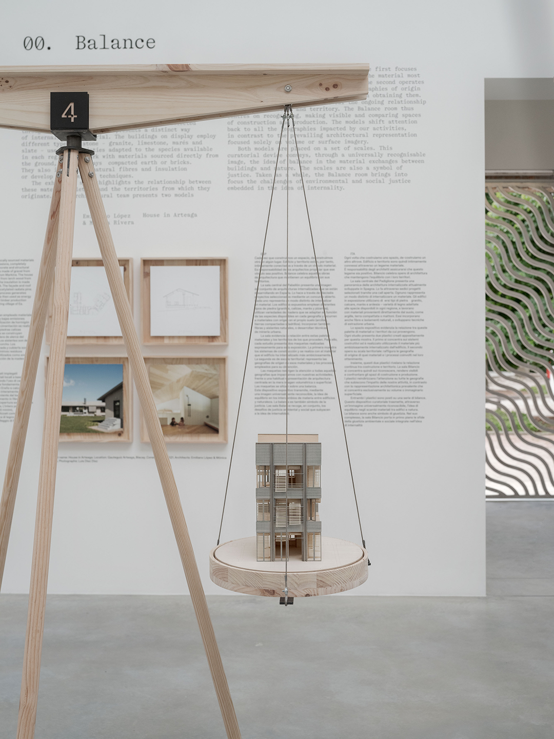 Gallery space with mounted wall art and models