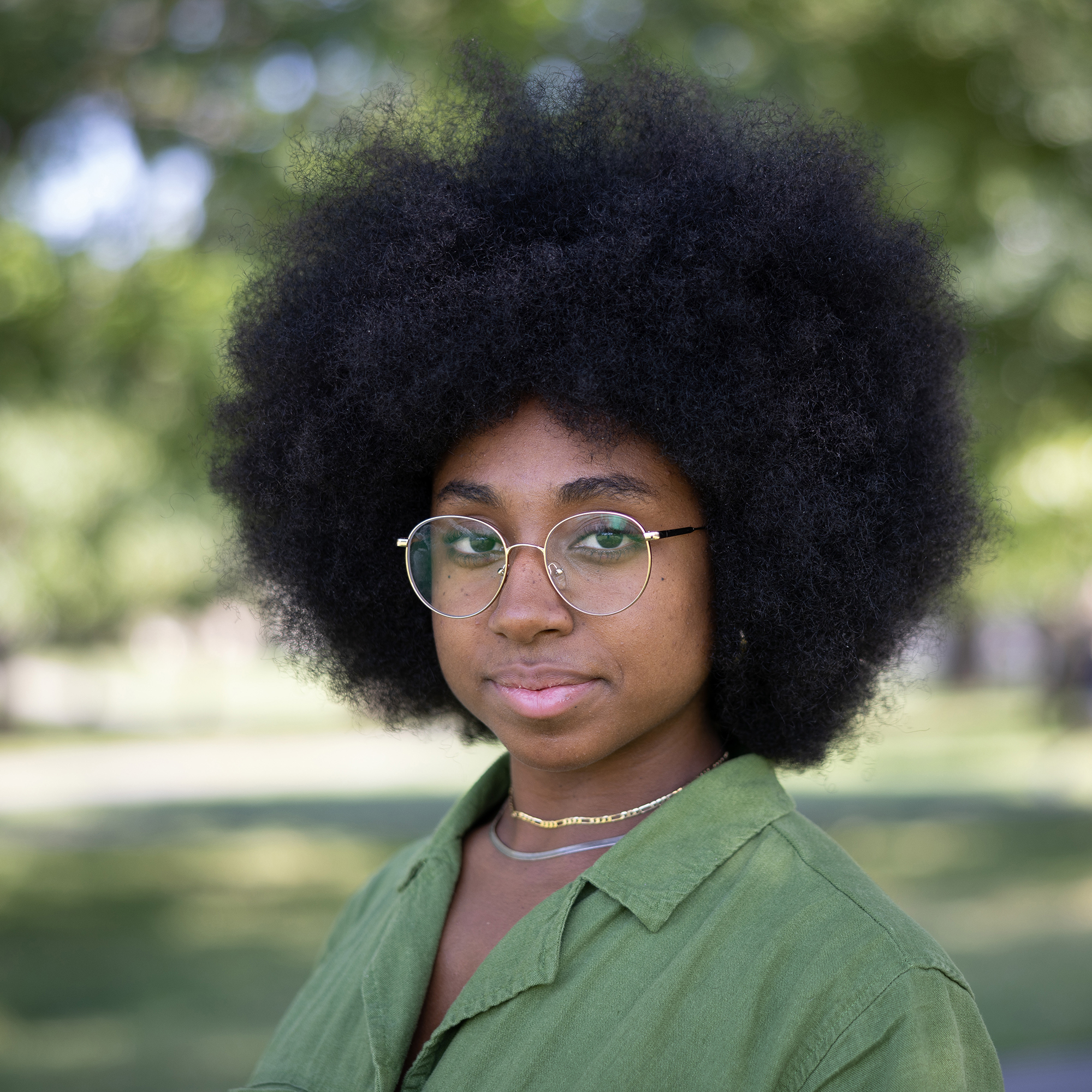 Person wearing glasses and green shirt