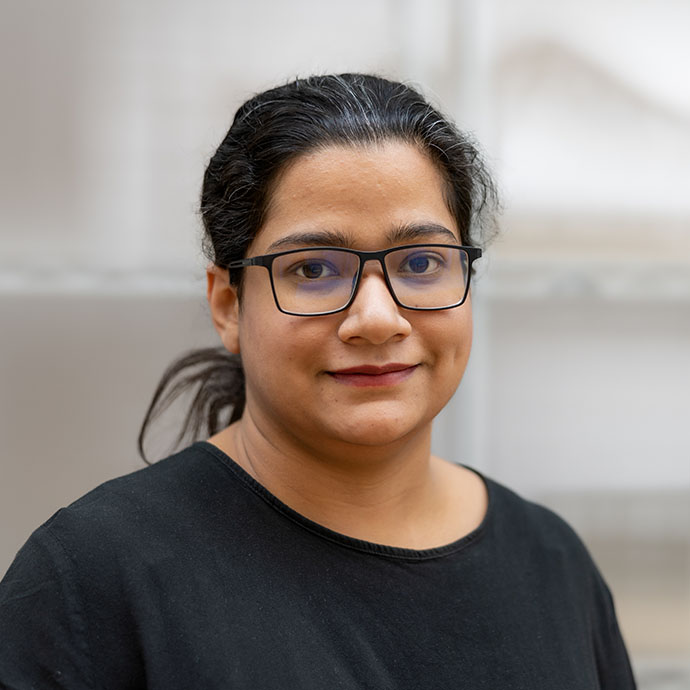 a person wearing glasses and a black shirt