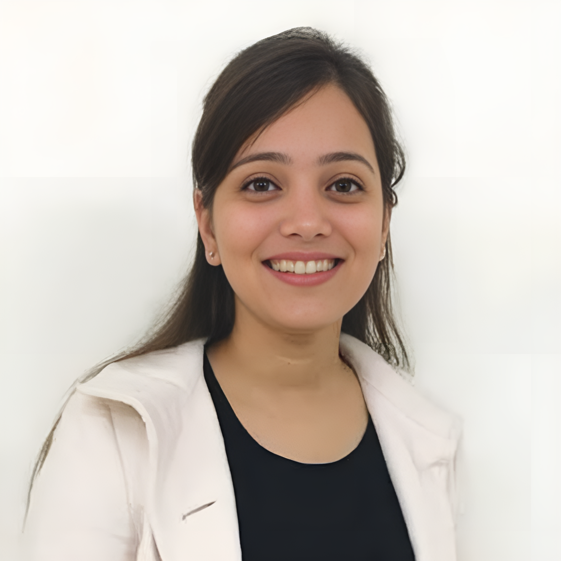 Person wearing pink jacket over black shirt.