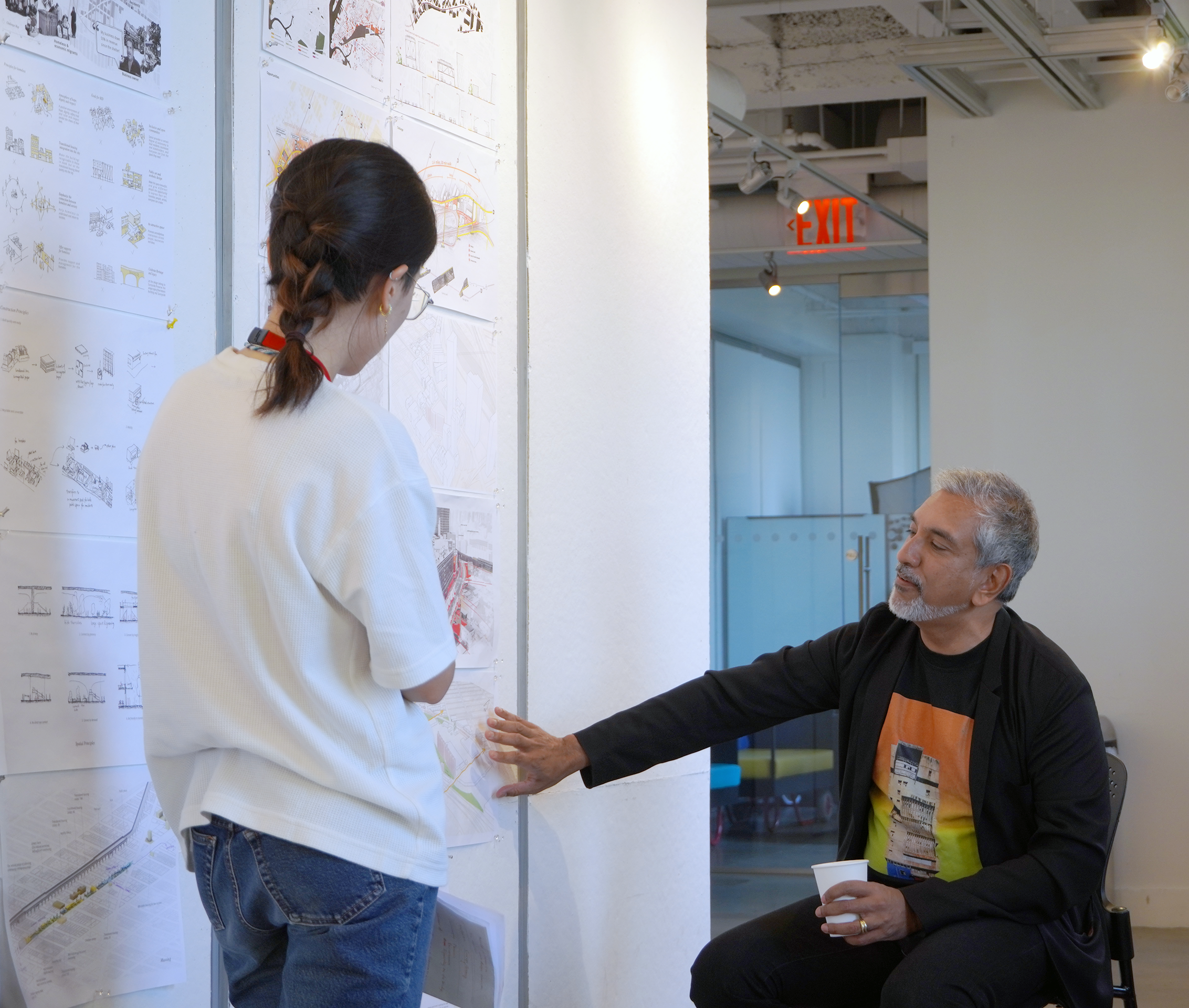 student discussing work with teacher