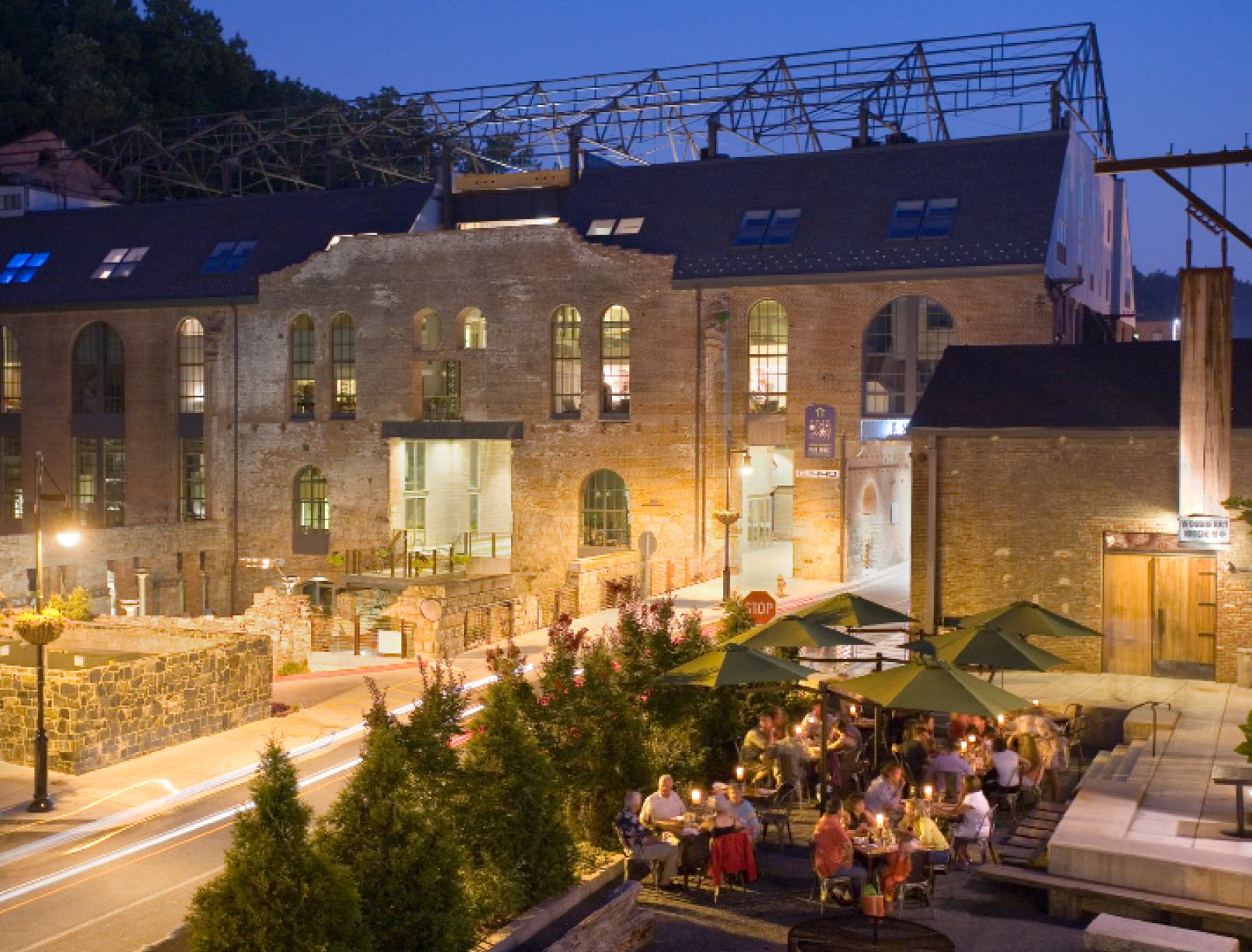 Exterior of a stone building with an outdoor seating area
