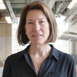 woman with bobbed reddish hair wearing a black blouse