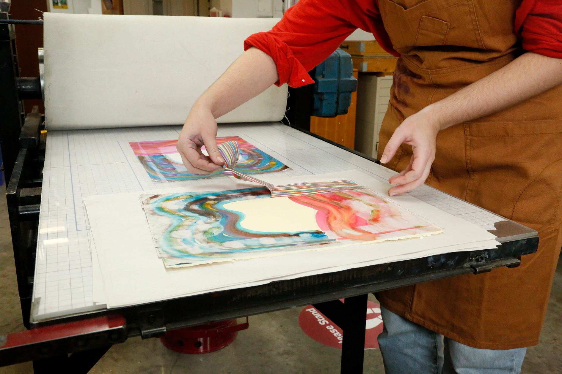 Student creating printed artwork
