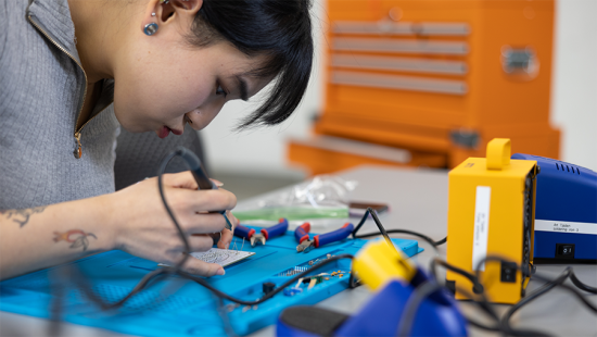 Student working with electrical tools