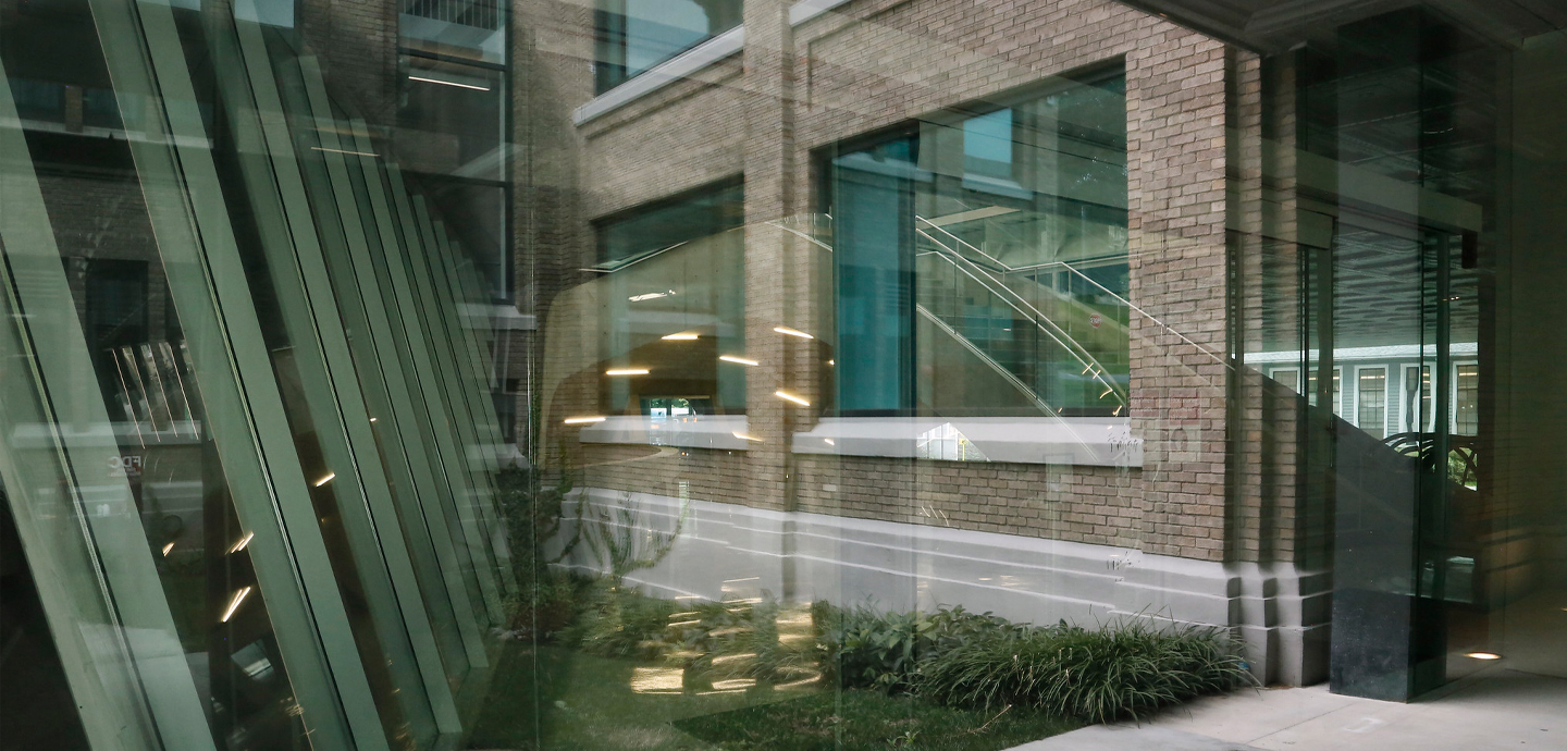 a view through a glass window with a building on the other side