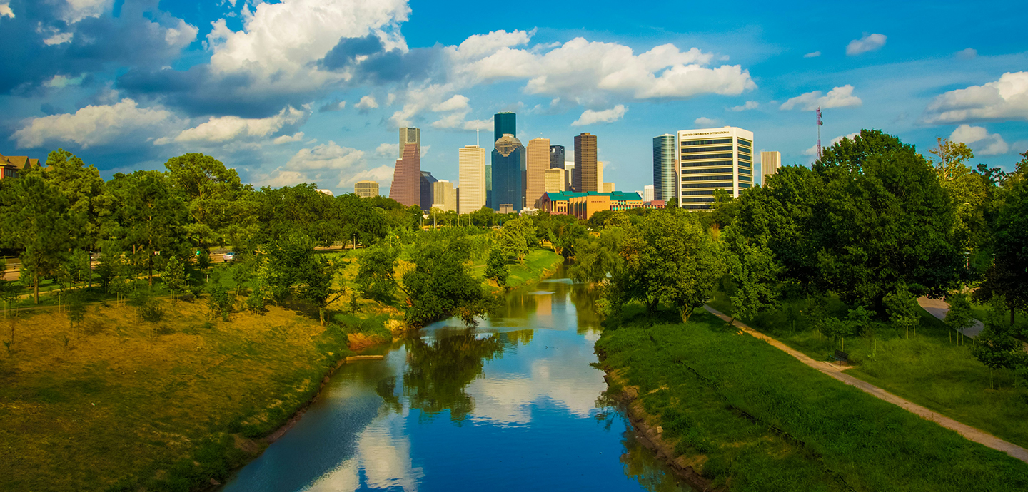 View of Houston from the river surrounded by greenery