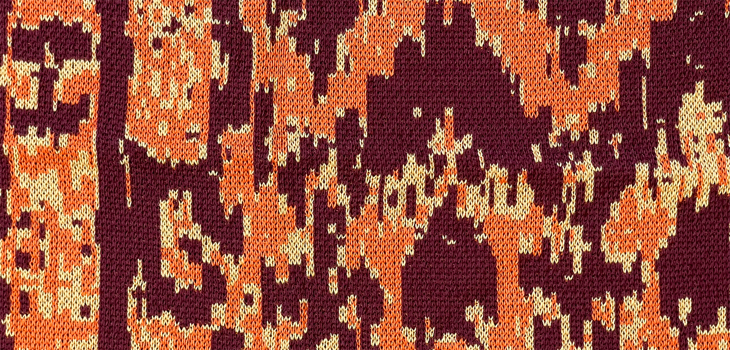 Detailed close-up of a knit textile using maroon