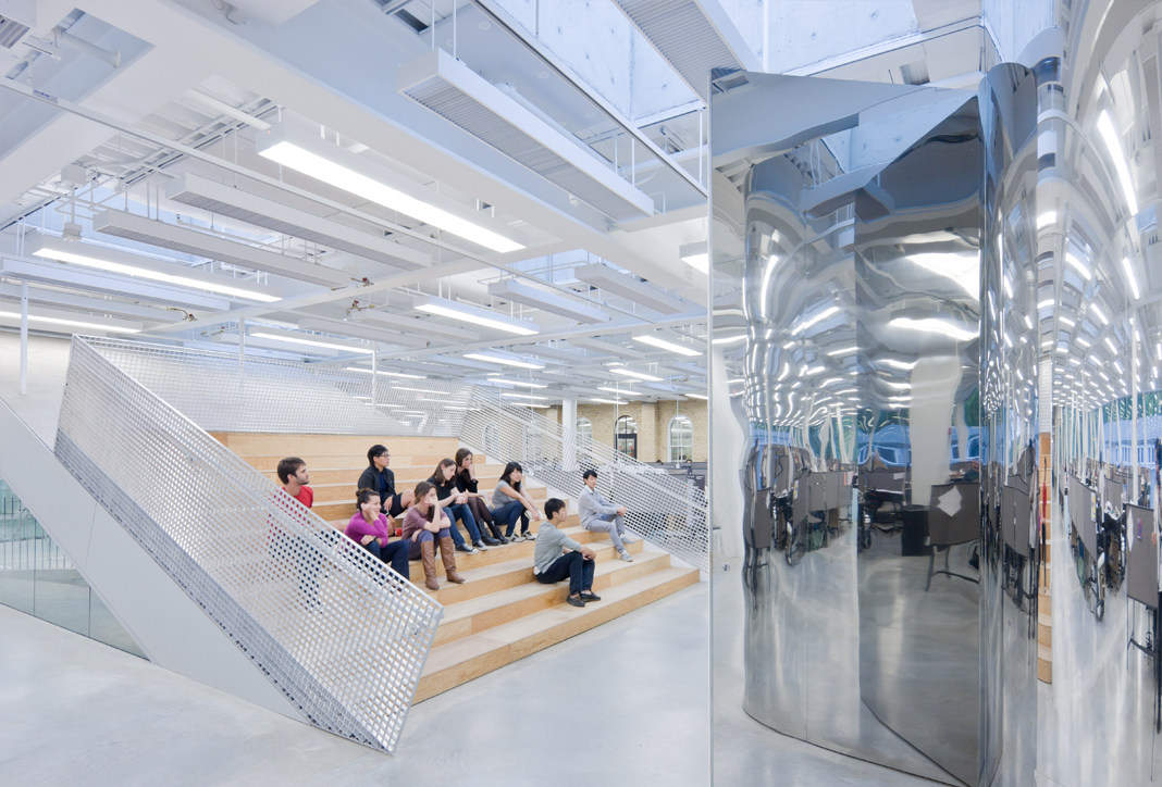Students seated on wooden steps