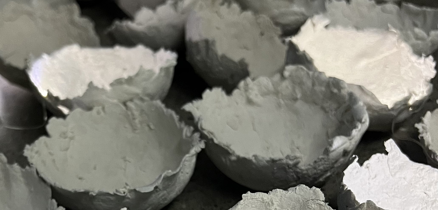 A large assortment of papier-mache bowls in varying sizes.