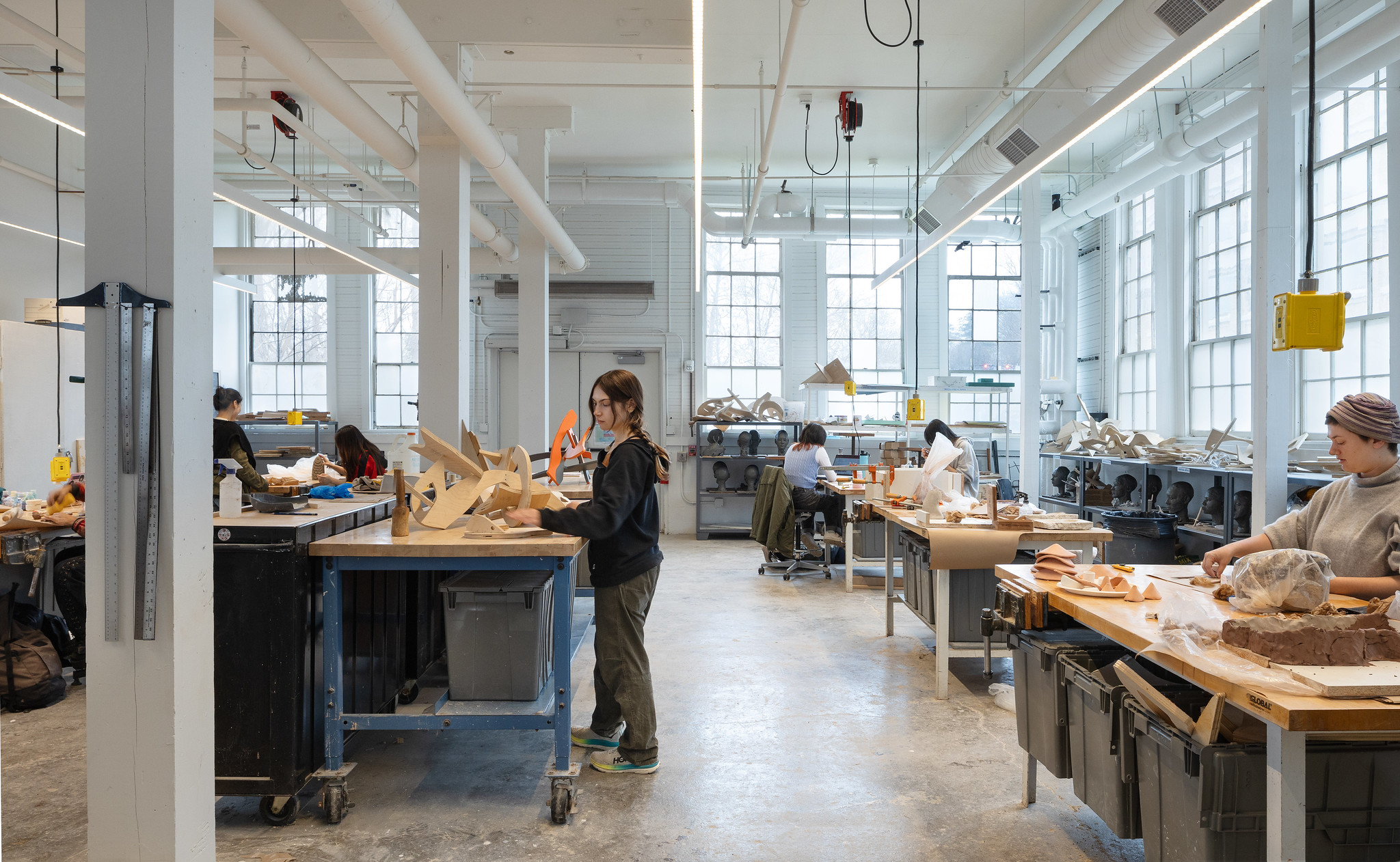 students working in a bright studio space