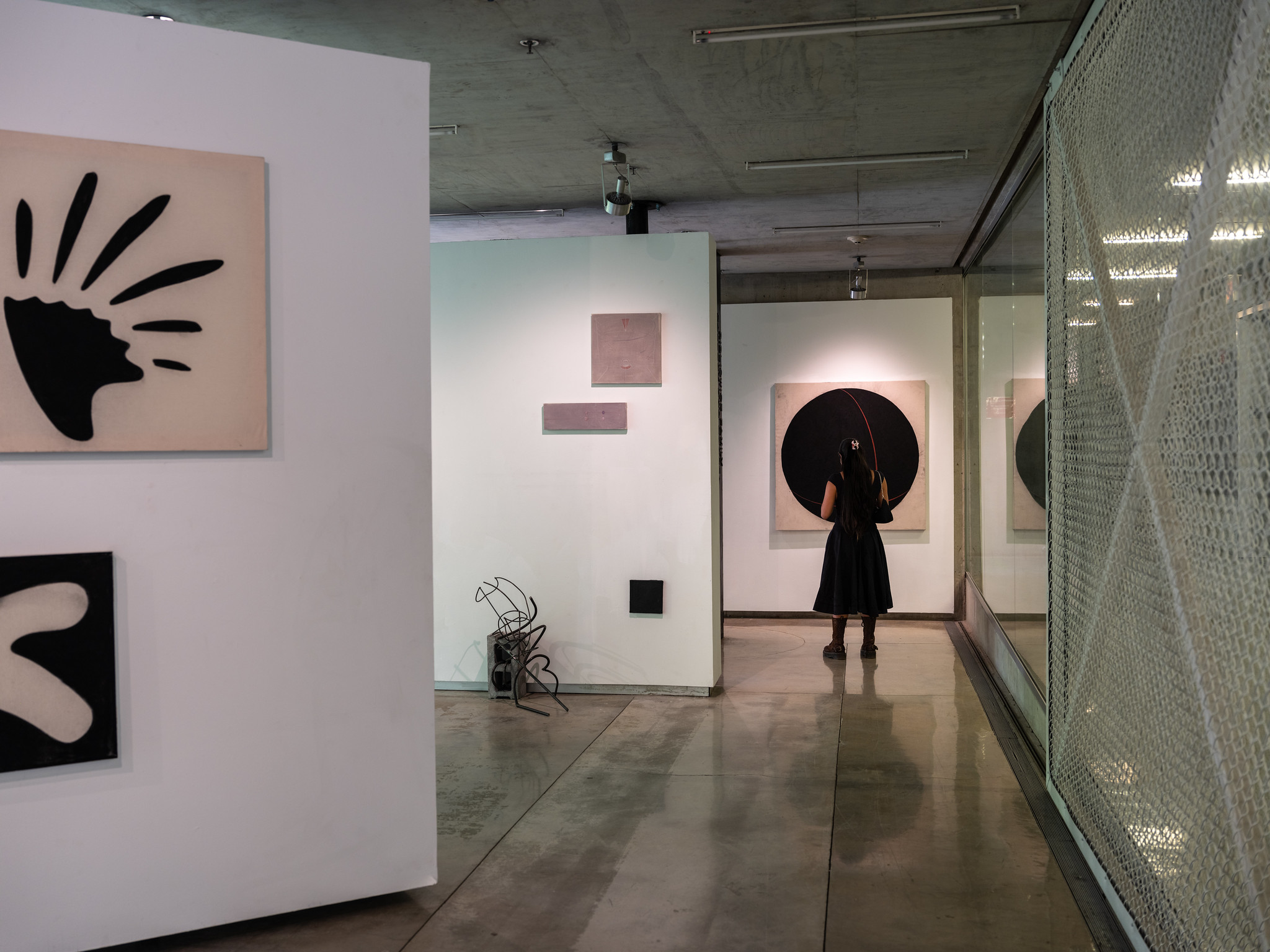 person viewing work in a gallery space