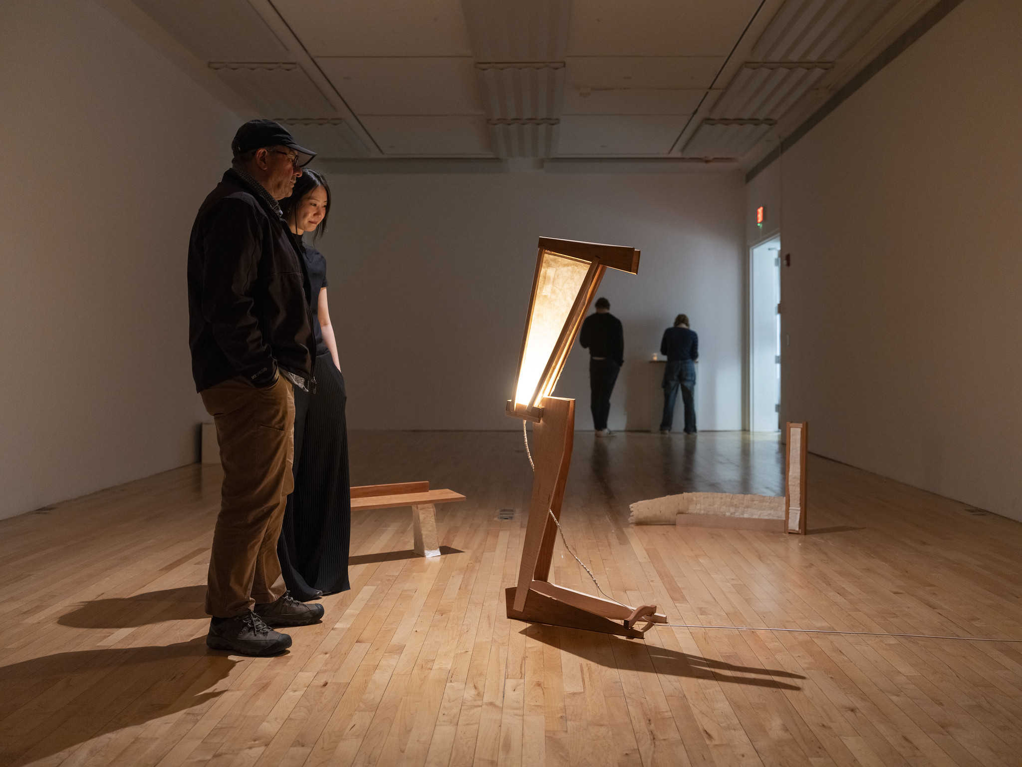 people viewing work in a gallery space