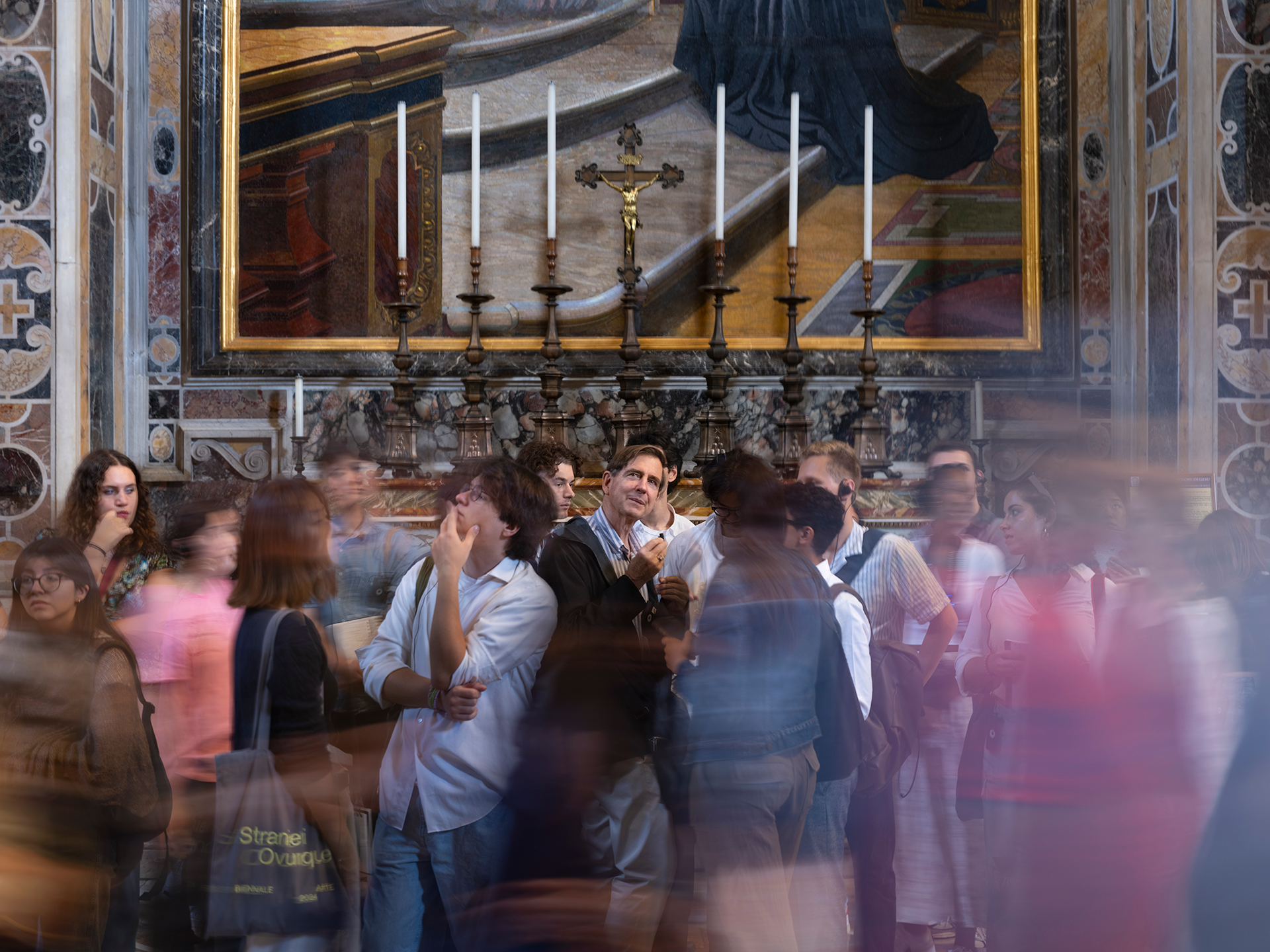 people gathered in a marble hall