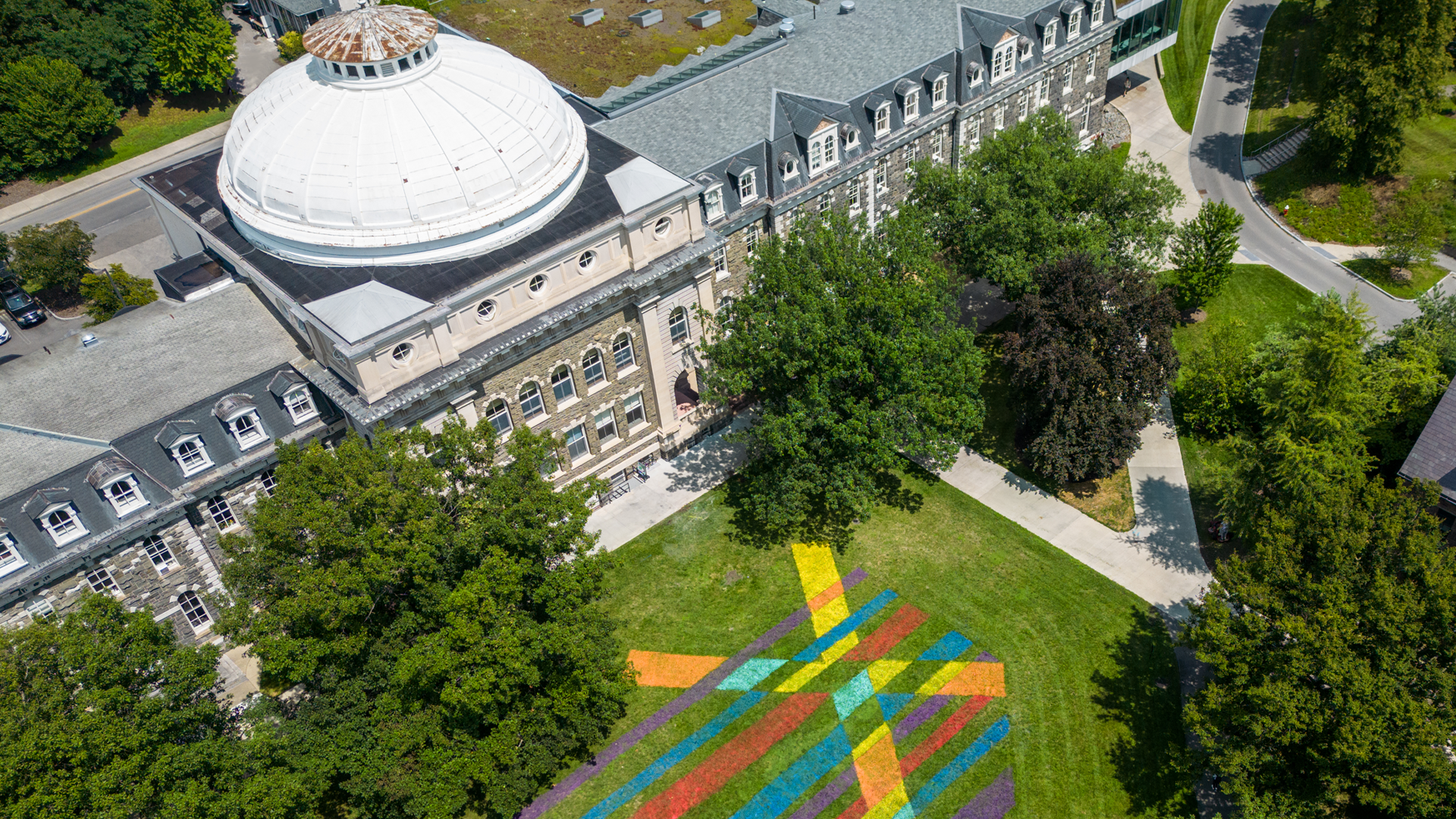 Aerial view of white-domed brick building