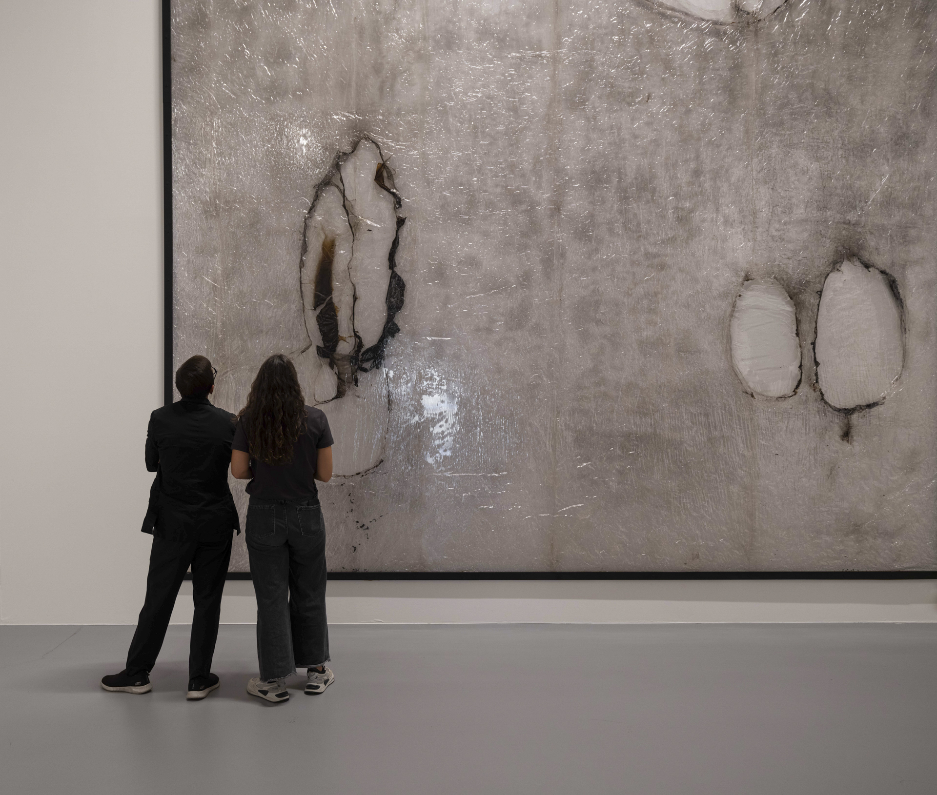 people viewing work in a gallery space