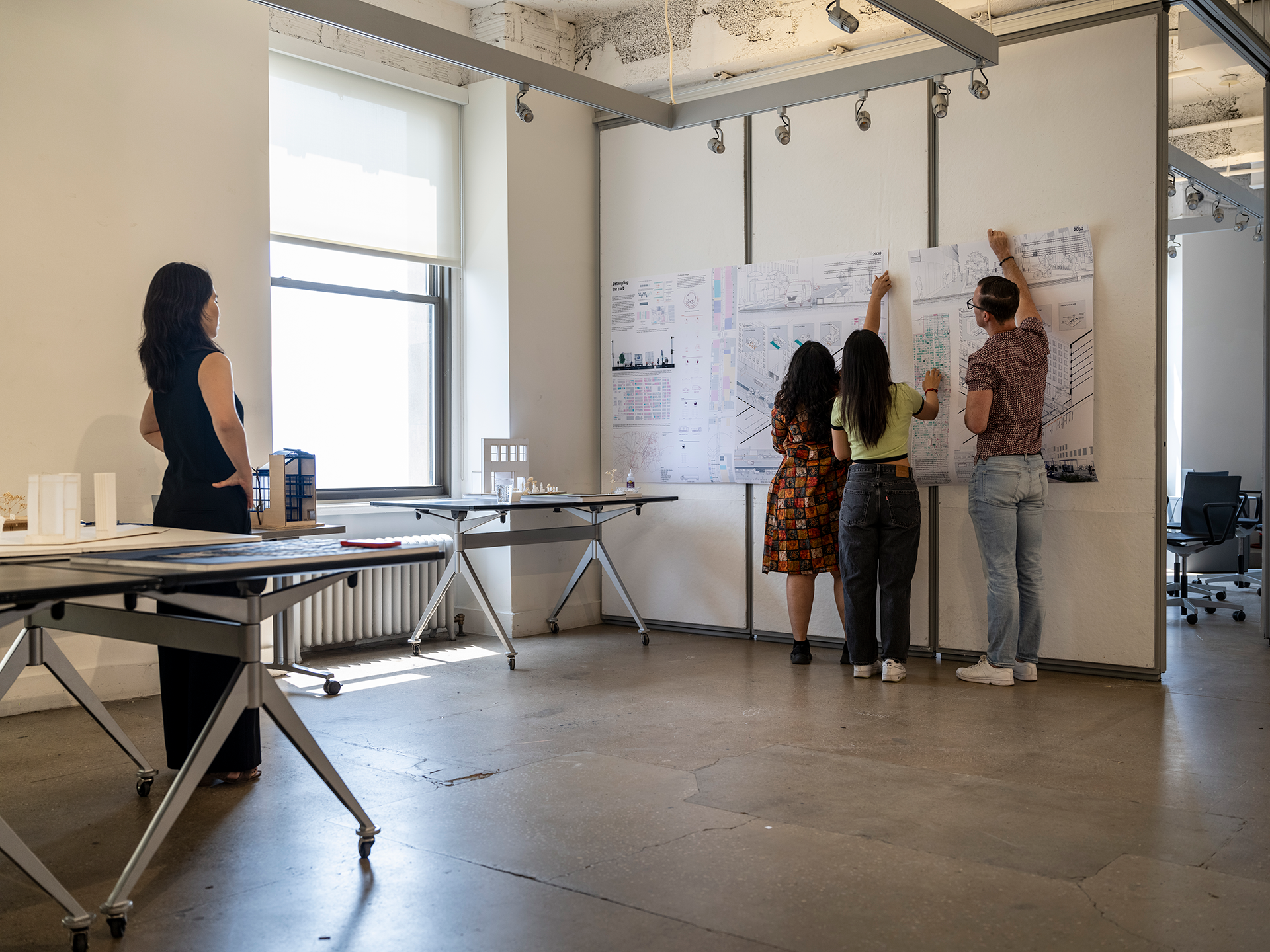 students pinning up work