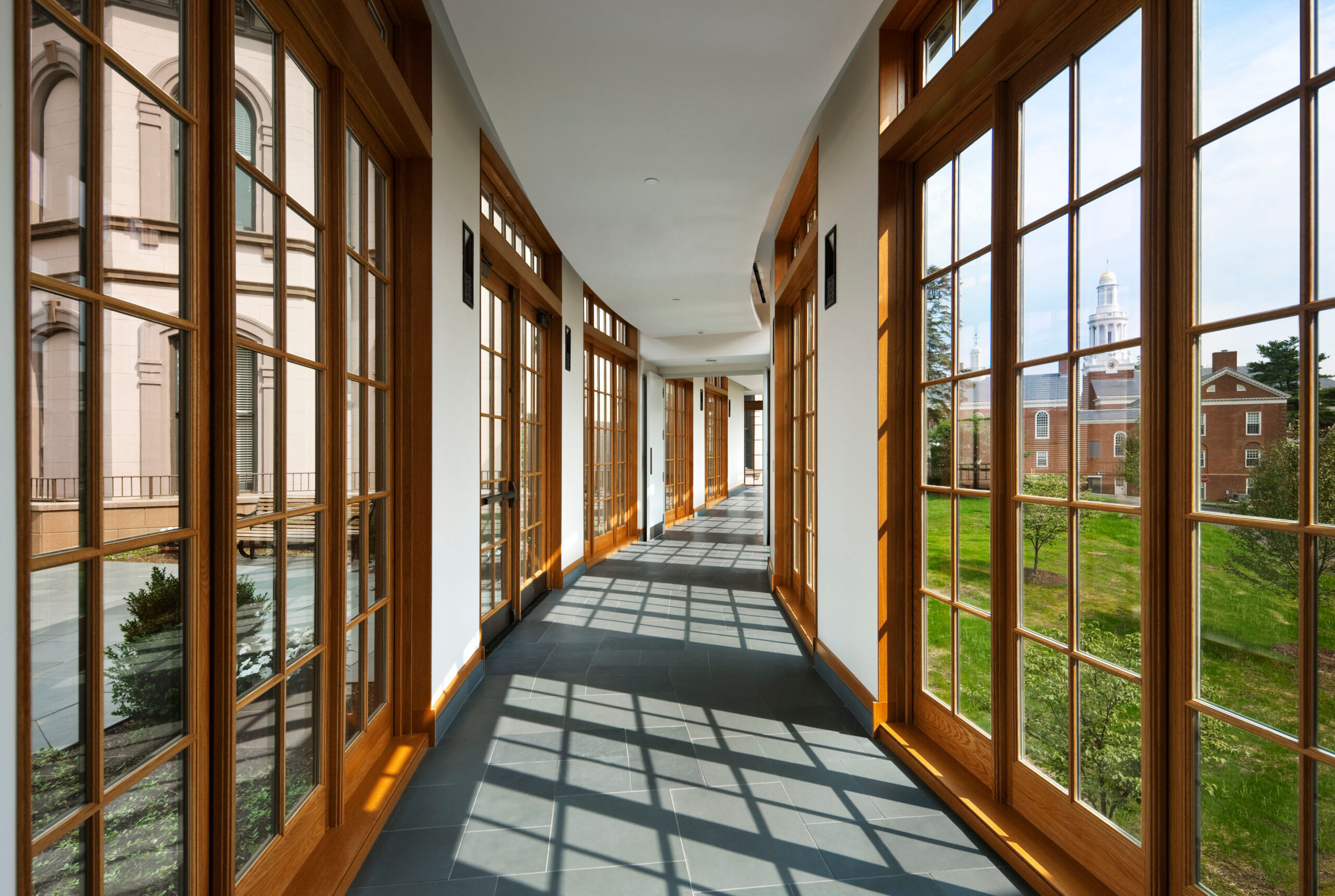 Interior hallway bordered by glass doors